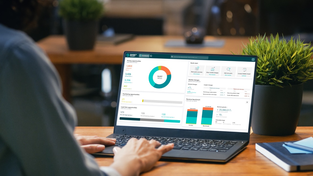 Person typing on a laptop which shows spare parts pricing software PRICERADAR
