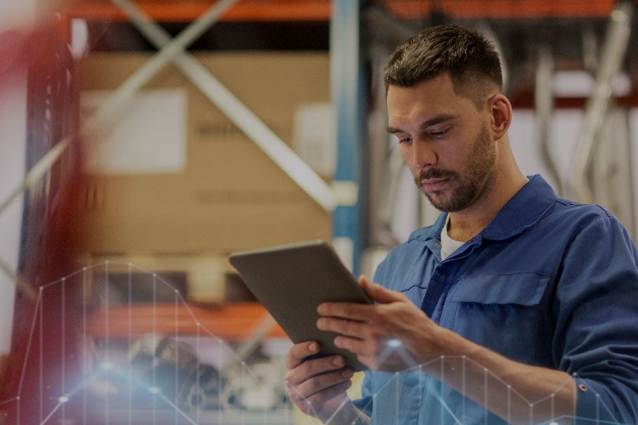 Man Using Ipad in Warehouse - Ultimate Guide Section 4 Man Using Ipad in Warehouse - Ultimate Guide Section 4