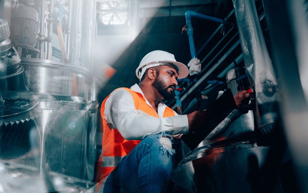 Image of a frontline worker operating a machine